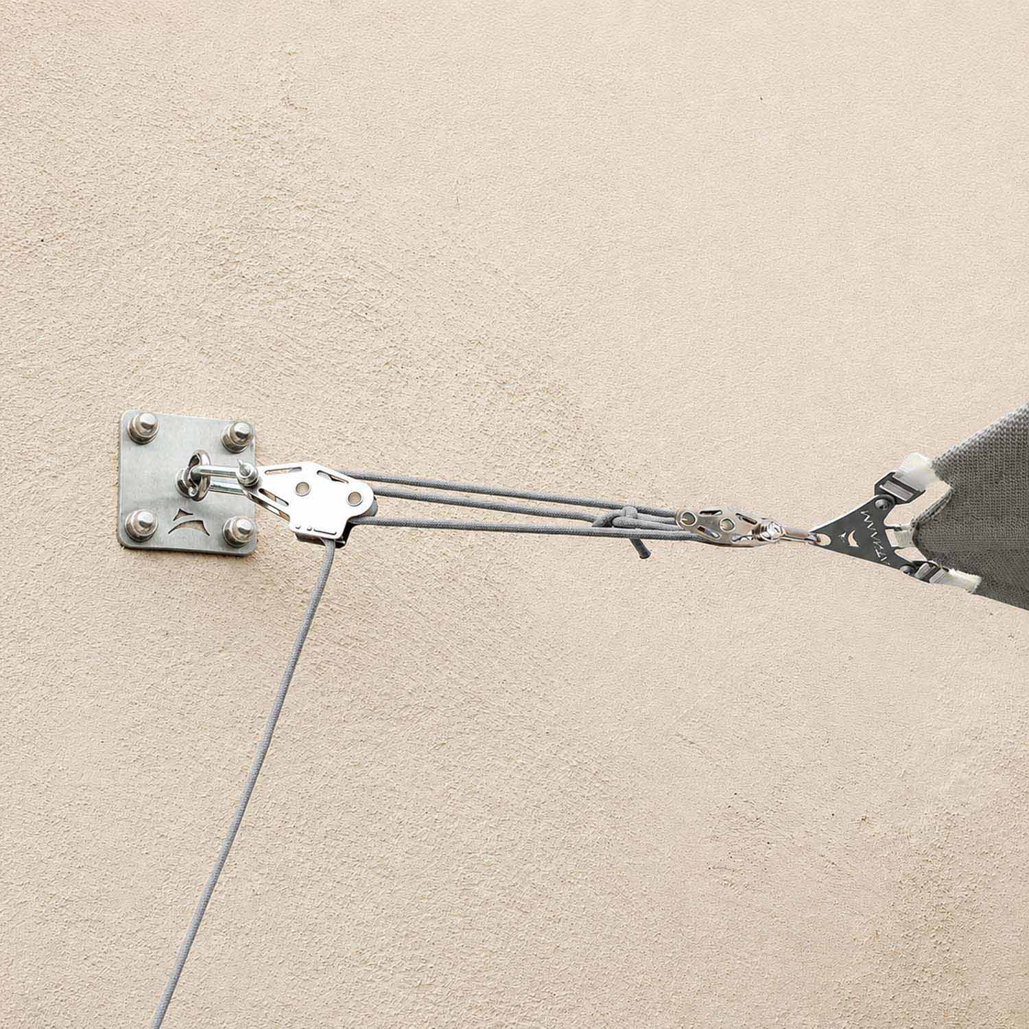 Holds the shade sail under load
